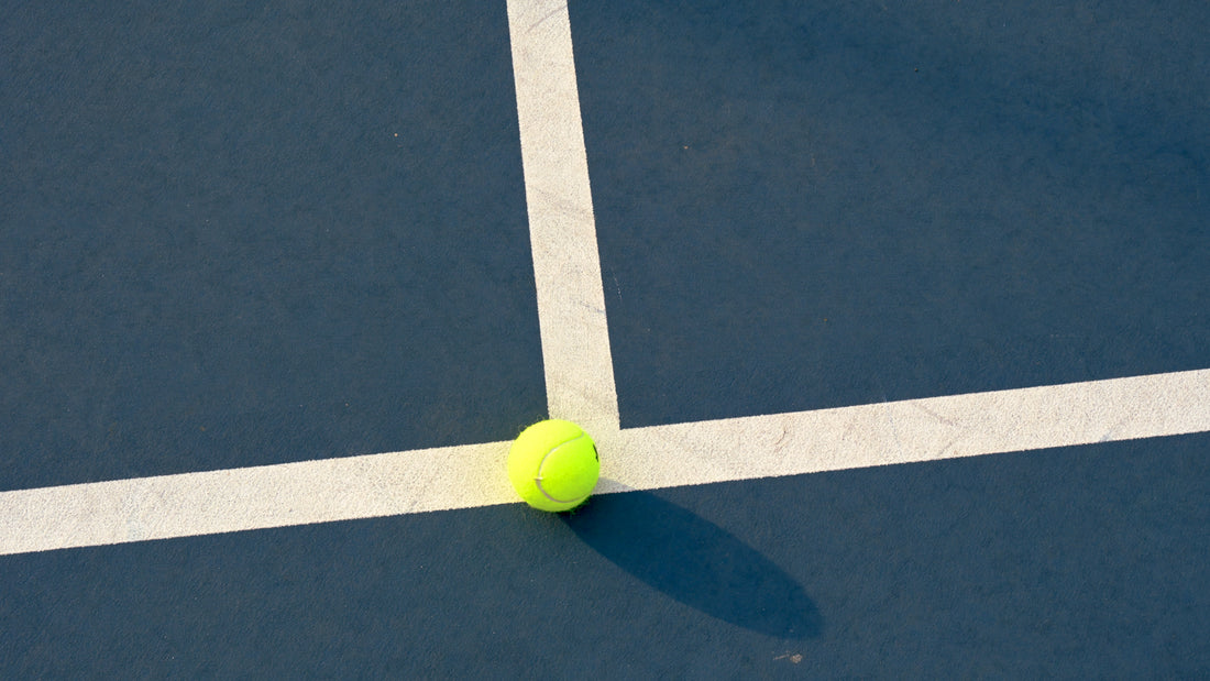 Close up of a tennis ball on a court