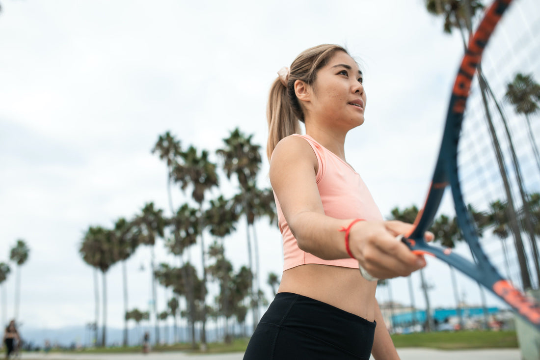 Close up of a woman with a tennis racquet