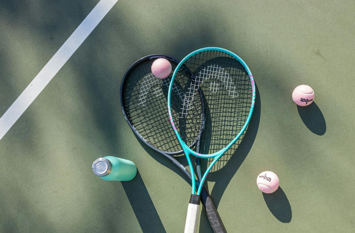 tennis racquets and balls on court