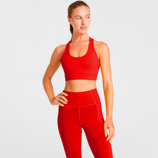 Woman wearing a red racerback sports bra