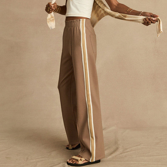 Brown track pants with stripe on the side