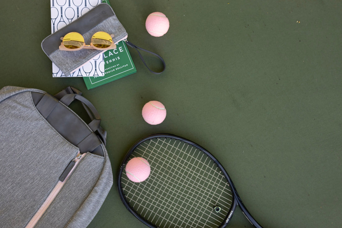 Contents of a tennis bag on the court