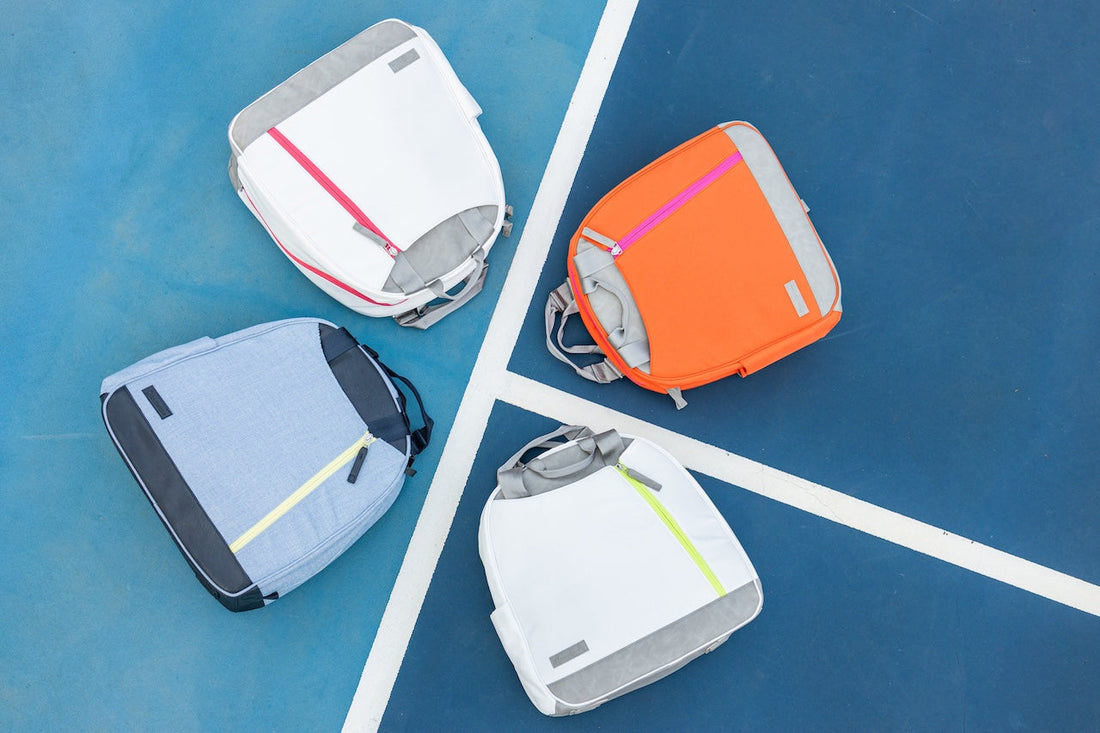 Doubletake Melbourne bags on tennis court.