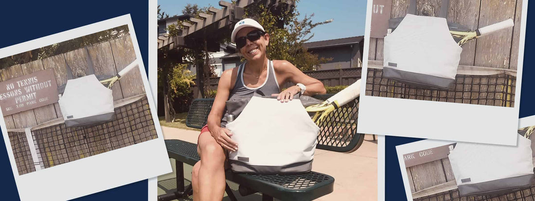 Woman with Doubletake tennis bag, sitting on a bench.