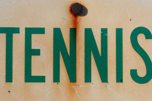 Tennis sign with rusted nail
