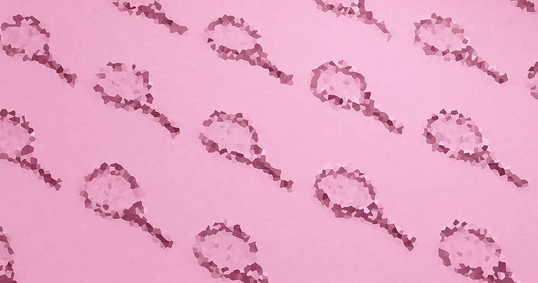 Pink background with balls shaped in form of tennis racquets