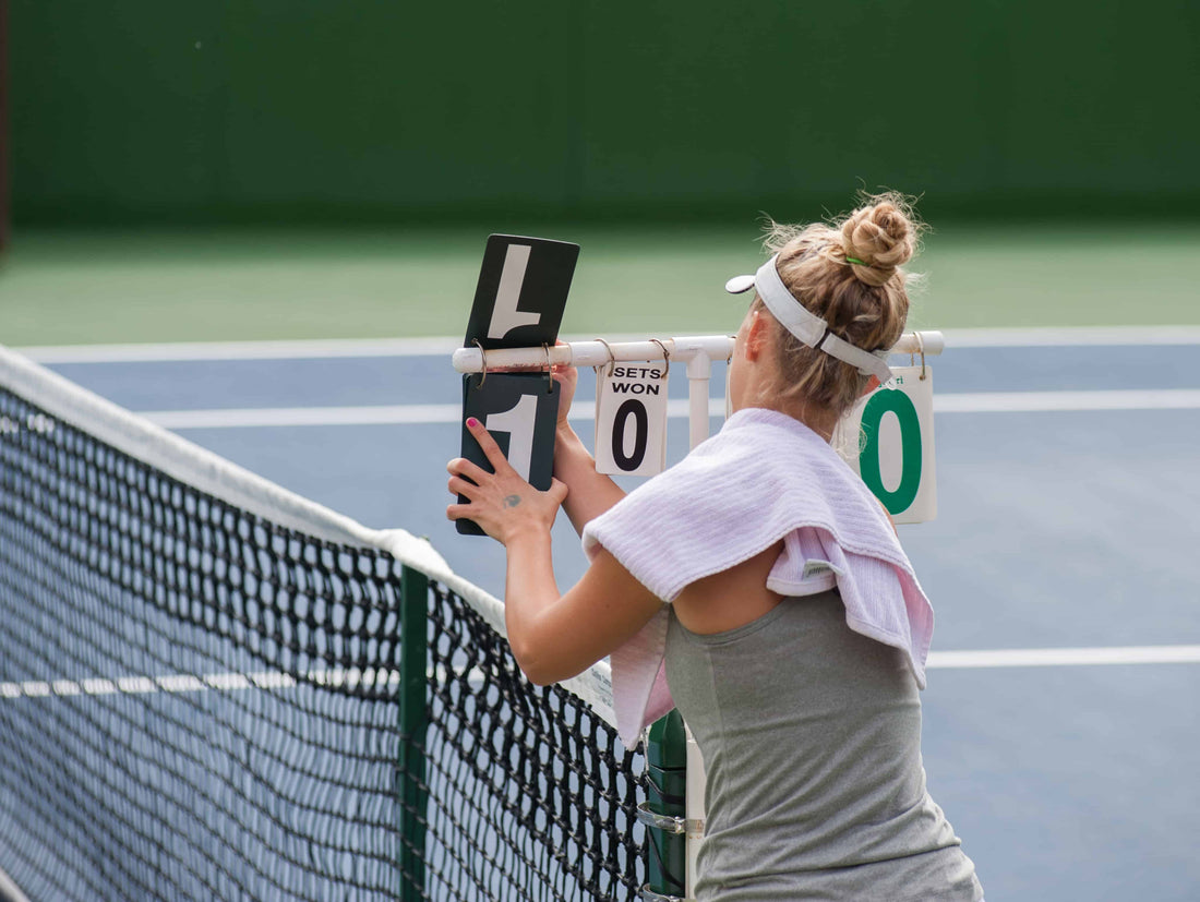 Woman Changing Tennis Score