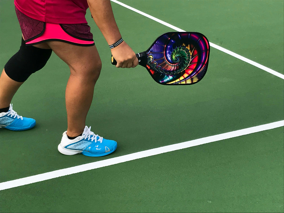 Woman hitting pickleball