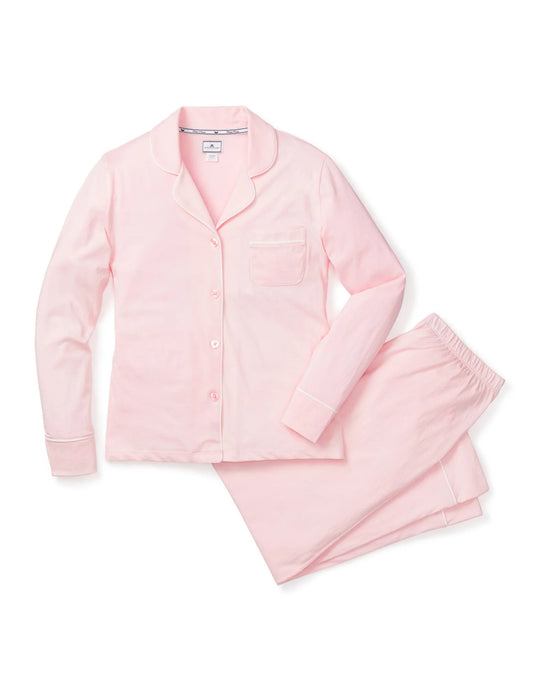 Soft pink pajama set folded neatly to display the top and bottoms.