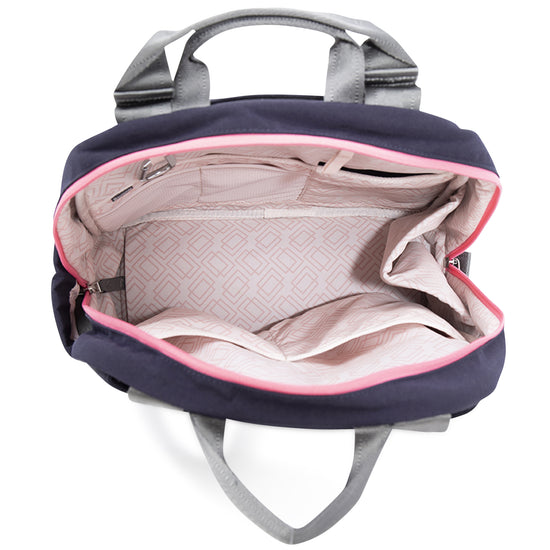 Open navy and pink bag with gray handles, showing spacious beige interior and multiple pockets inside.