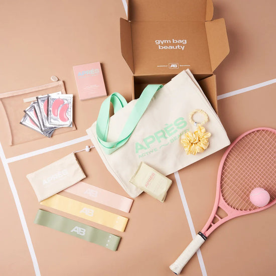 Kit of gym bag, resistance bands, eye masks, scrunchie, and tennis racquet.