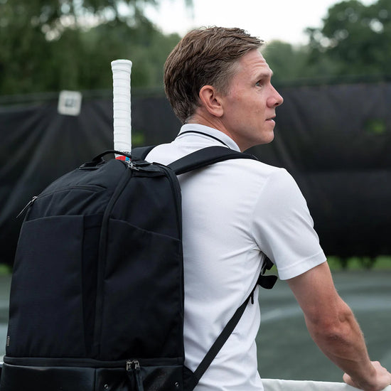 Man wearing the NYC Tennis Backpack