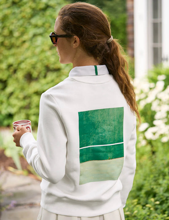 Sweater with tennis court graphic on the back. 