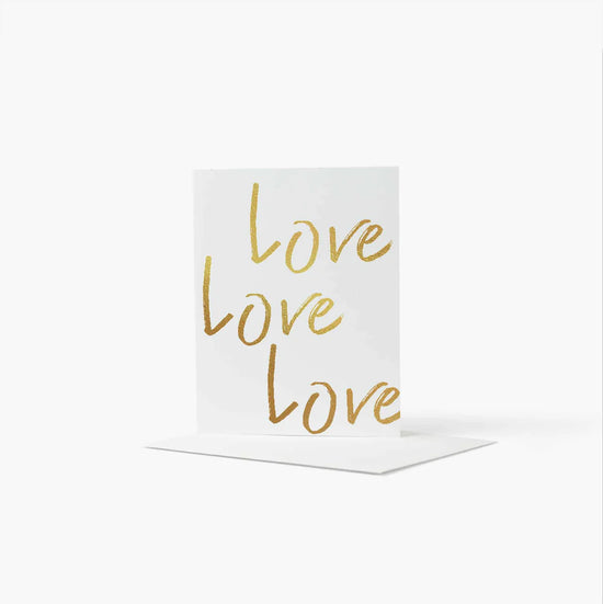 Card with Love written in gold lettering