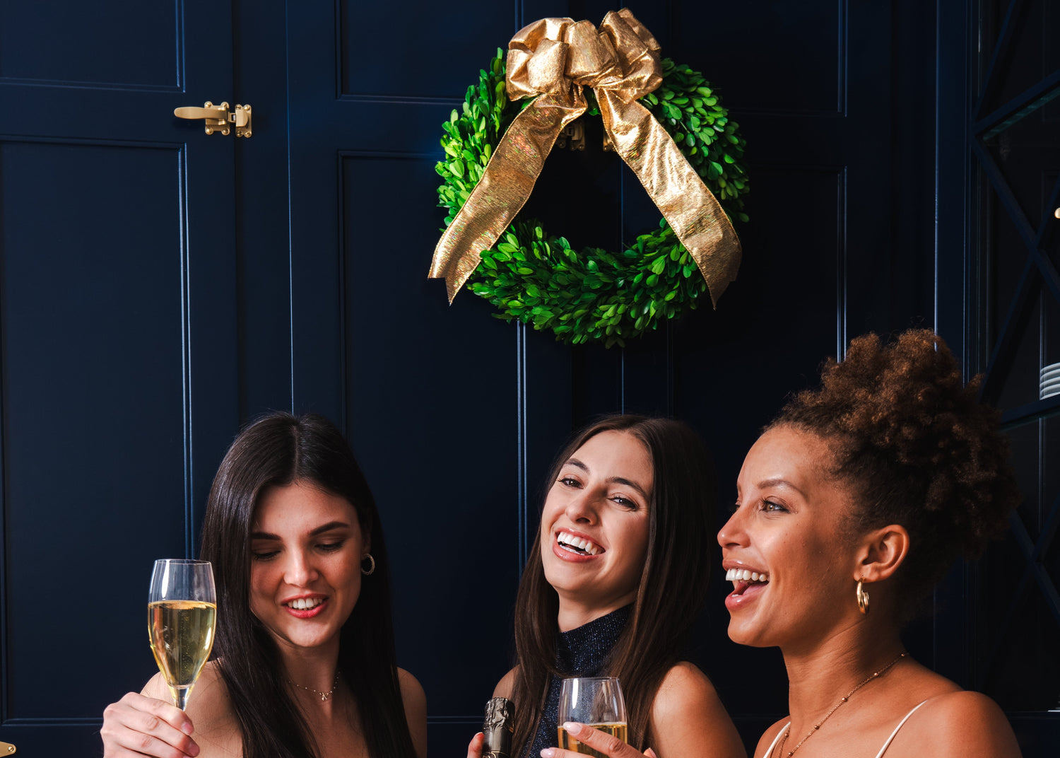 Three woman toasting with champagne