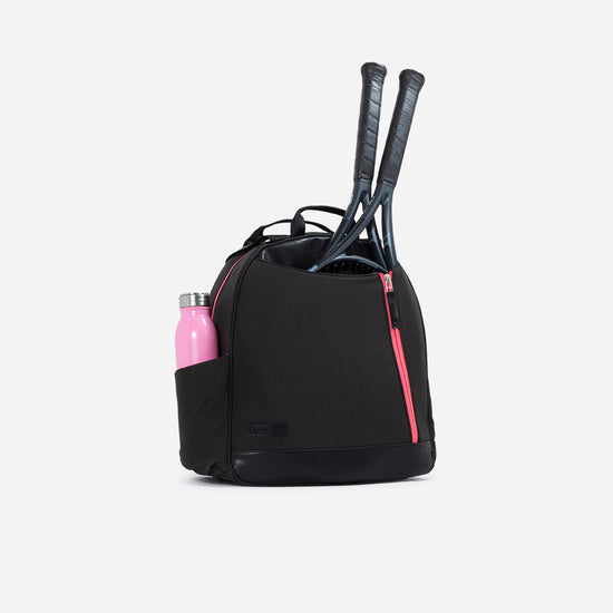 Black tennis backpack with pink zippers, holding two racquets and a pink water bottle in side pocket.