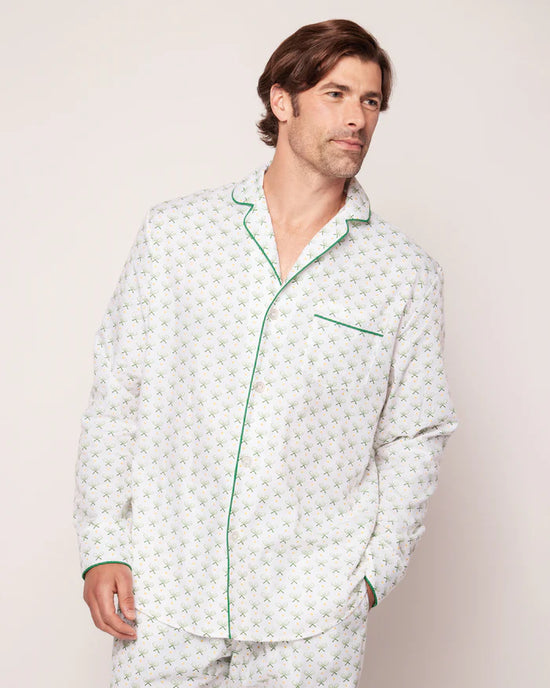 Man wearing PJ set with tennis racquet pattern.