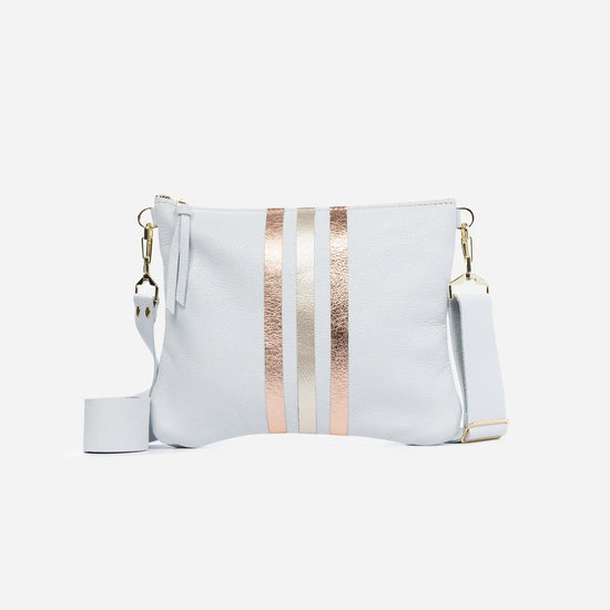 White leather crossbody bag with 3 rose gold and gold stripes in the front