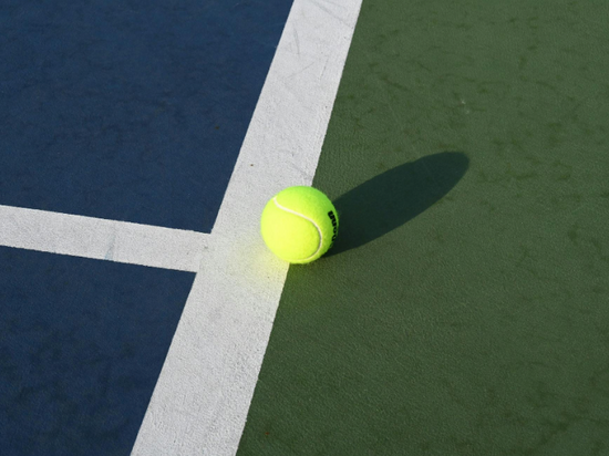 Tennis ball on tennis court.