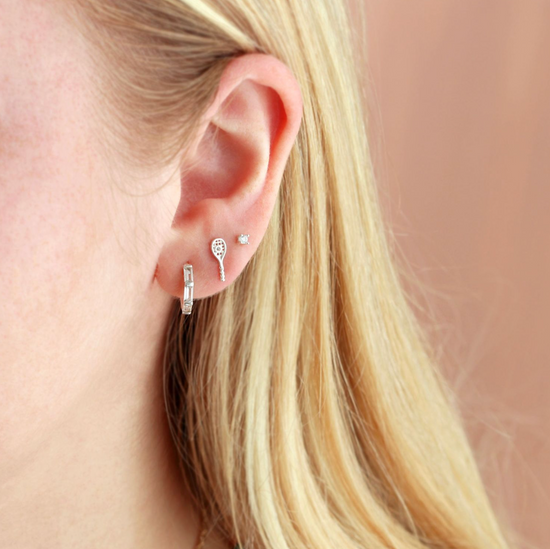 Small tennis racquet earring.