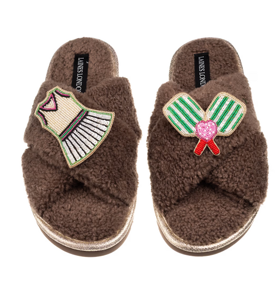 Fuzzy slippers with dress and pickleball paddle brooches. 