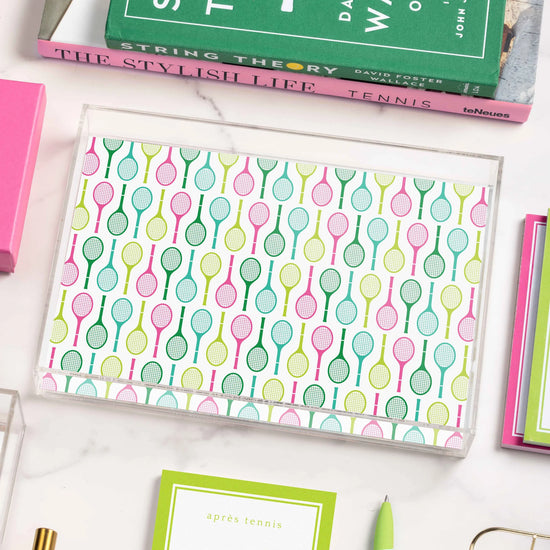 Acrylic tray with tennis racquet pattern.