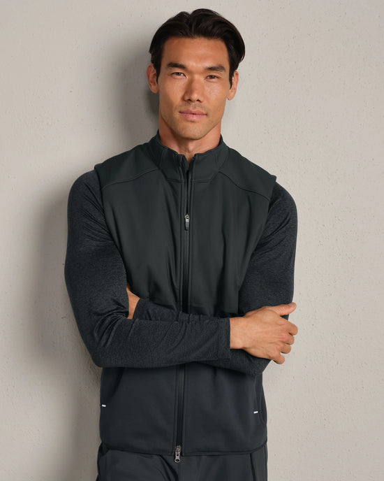 Man wearing black vest.