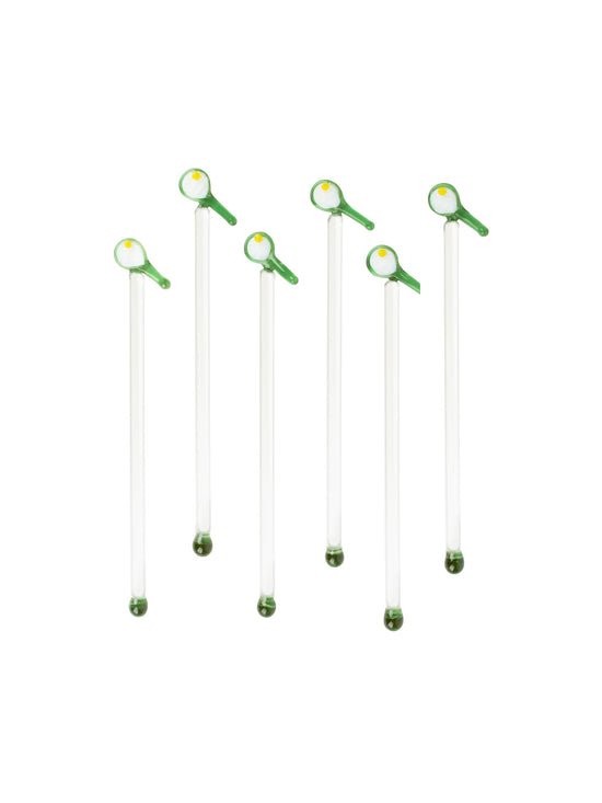 Six clear glass swizzle sticks with green avocado ends, arranged vertically on a white background.