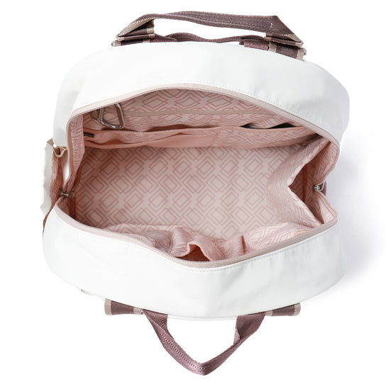 A white open bag with brown straps and a geometric pink interior lining.