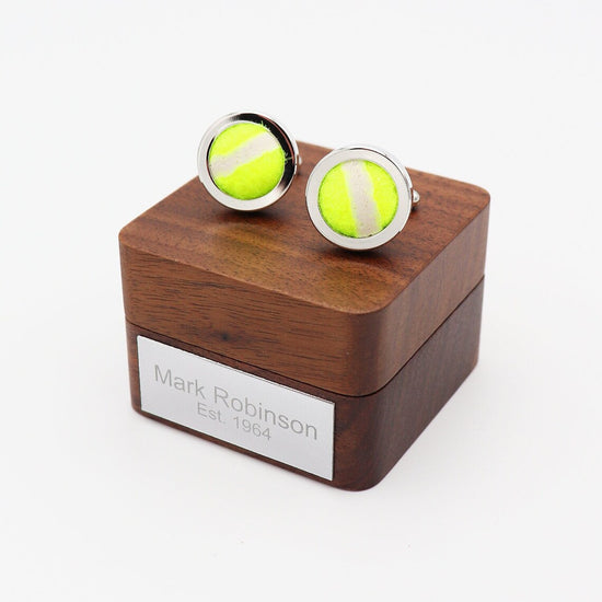 Tennis ball cufflinks.
