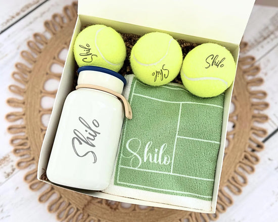 Gift set of personalized tennis ball, water bottle, and towel.